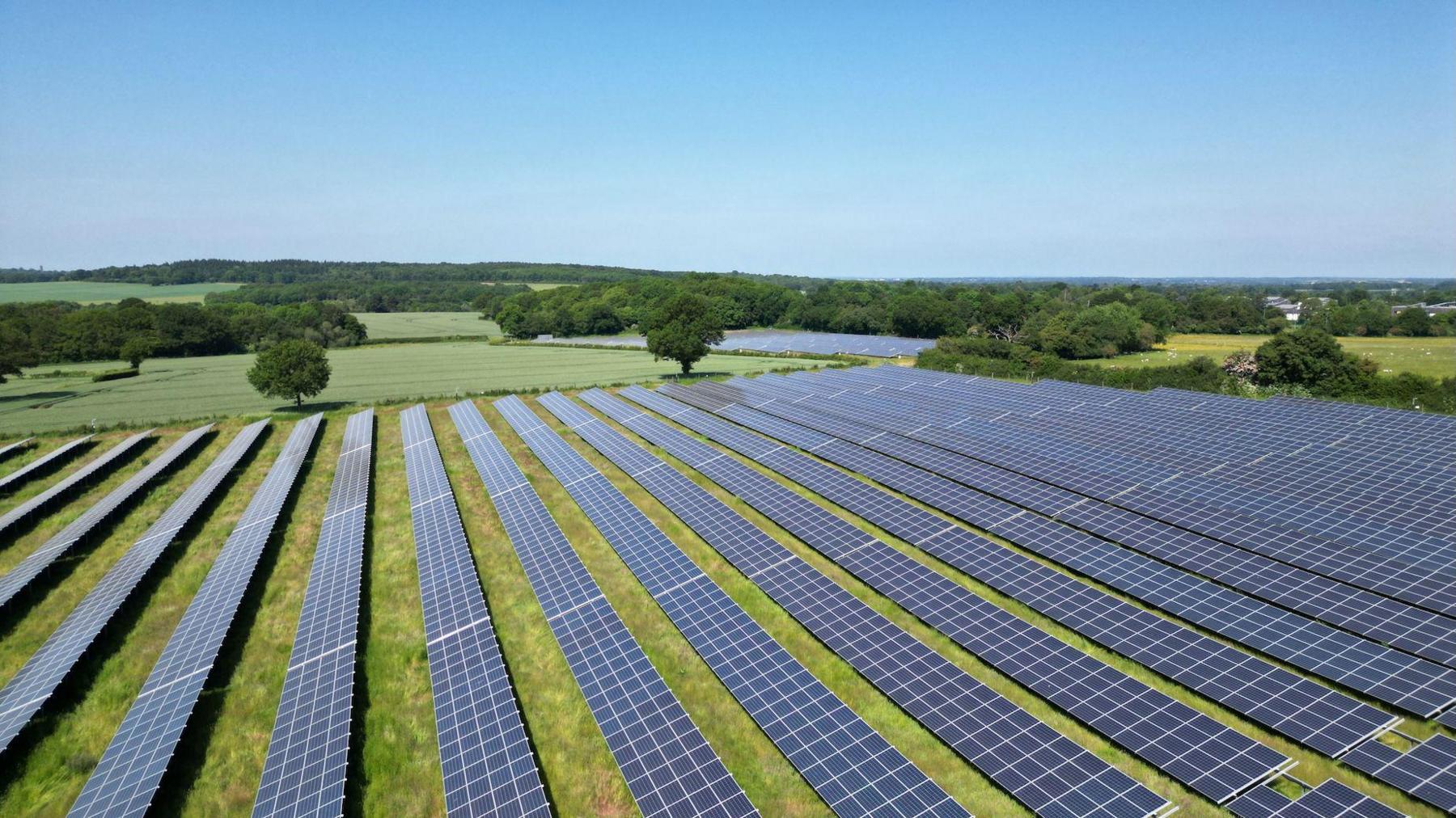Aerial view of solar panels at a solar farm