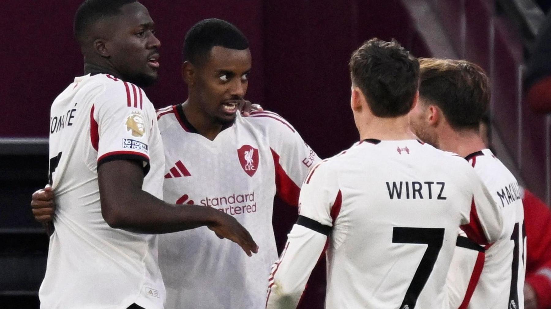 Liverpool players celebrate with Alexander Isak after his first Premier League goal for the club at West Ham United.