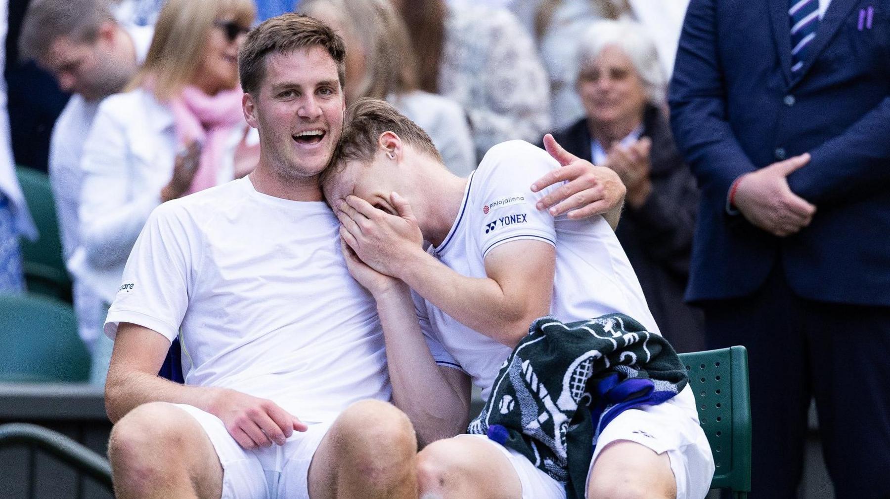 Henry Patten and Harri Heliovaara embrace