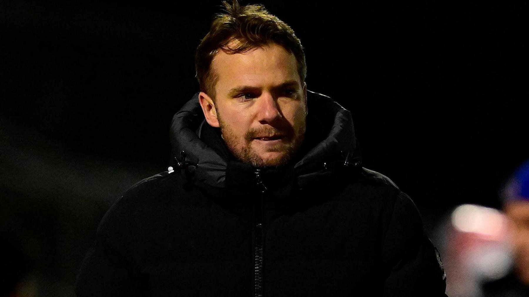 Tom Cleverley walks to the changing rooms following his red card