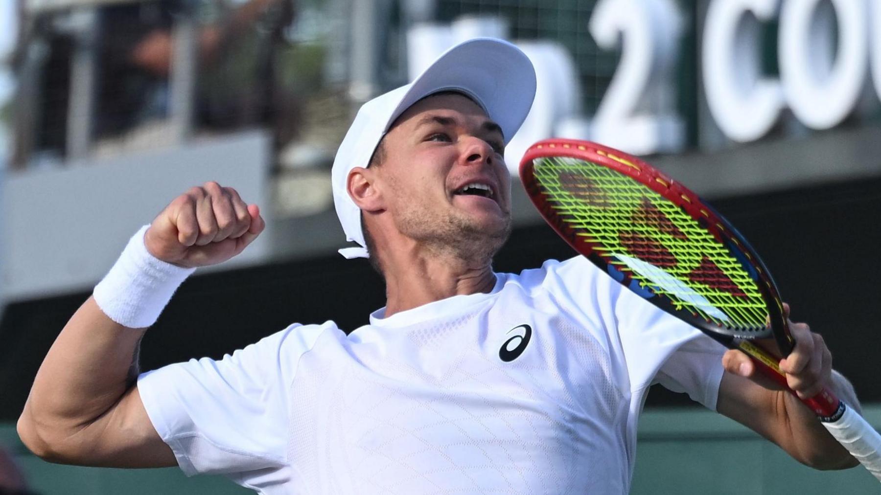 Kamil Majchrzak jumps for joy after beating Arthur Rinderknech at Wimbledon