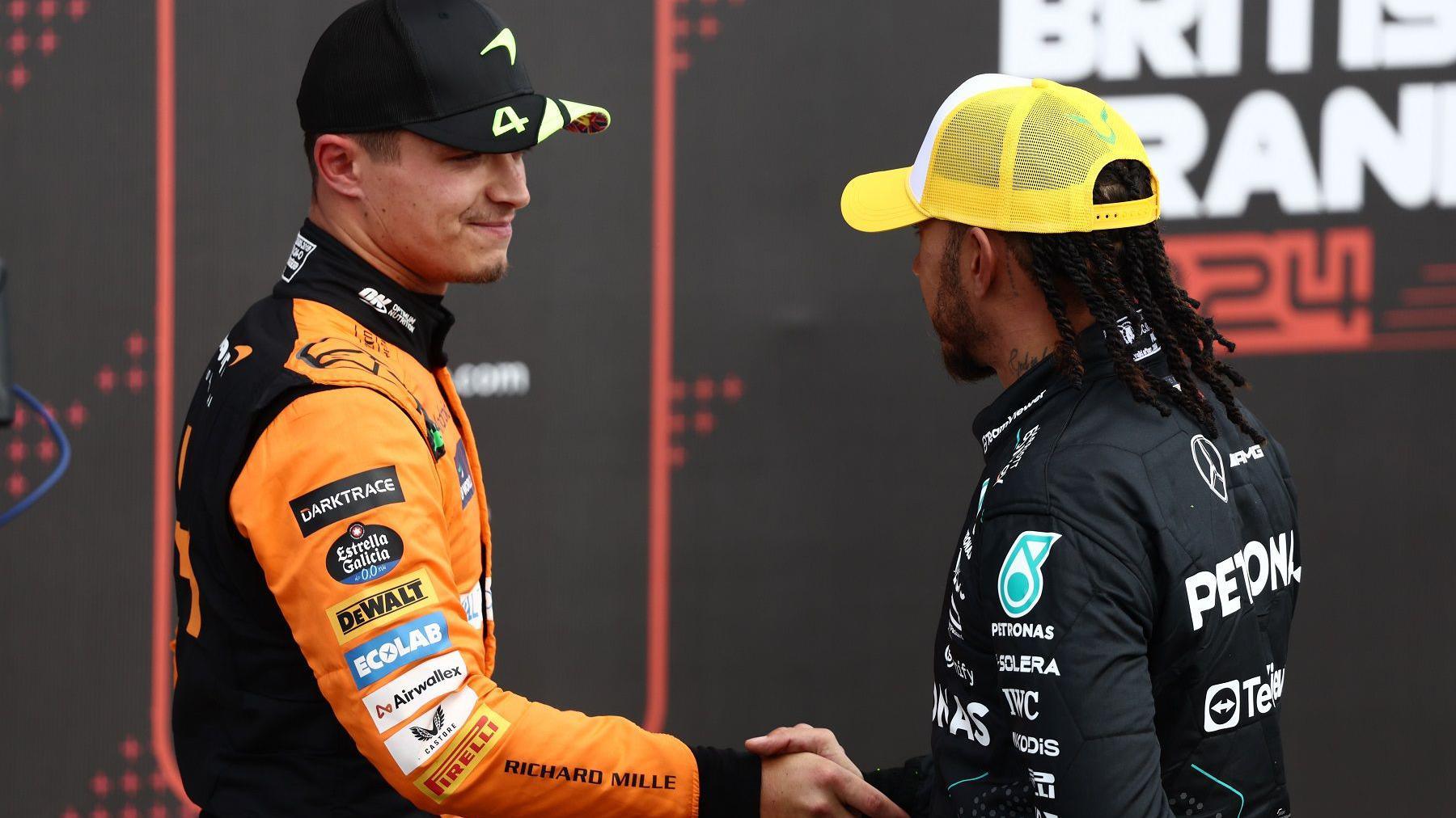 Lewis Hamilton (right) shakes hands with Lando Norris