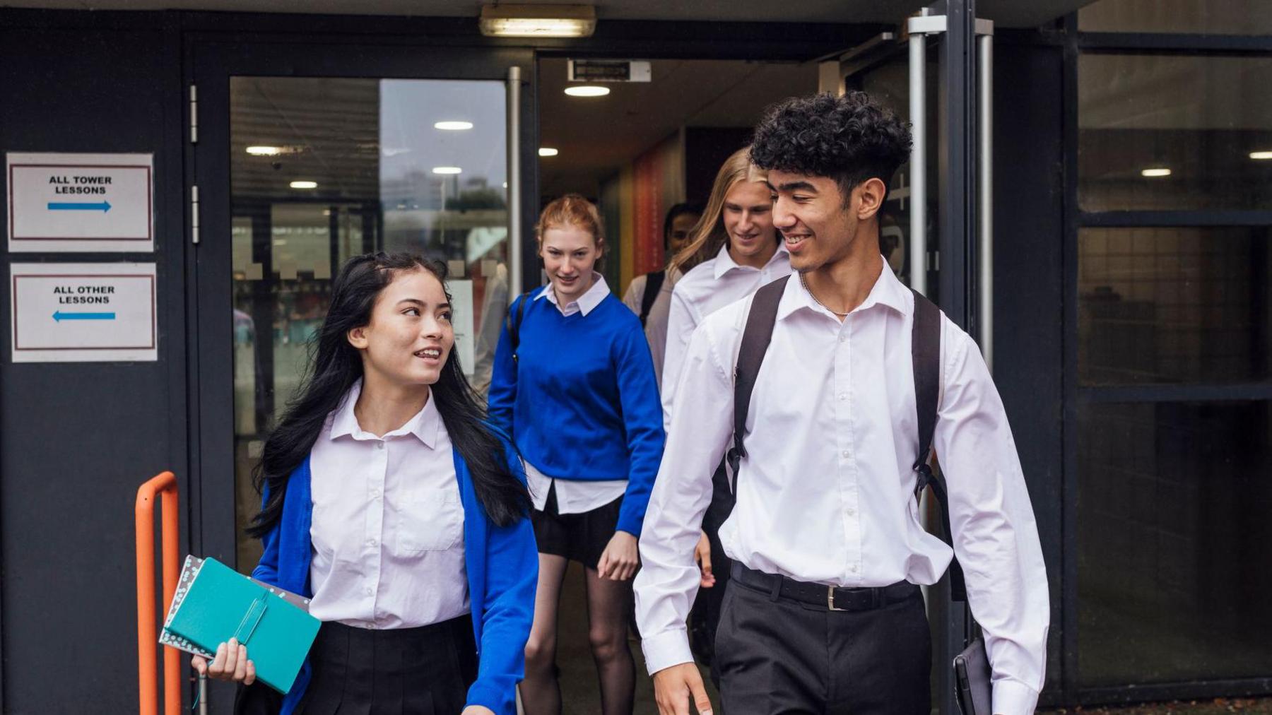 Students coming out out of school. 