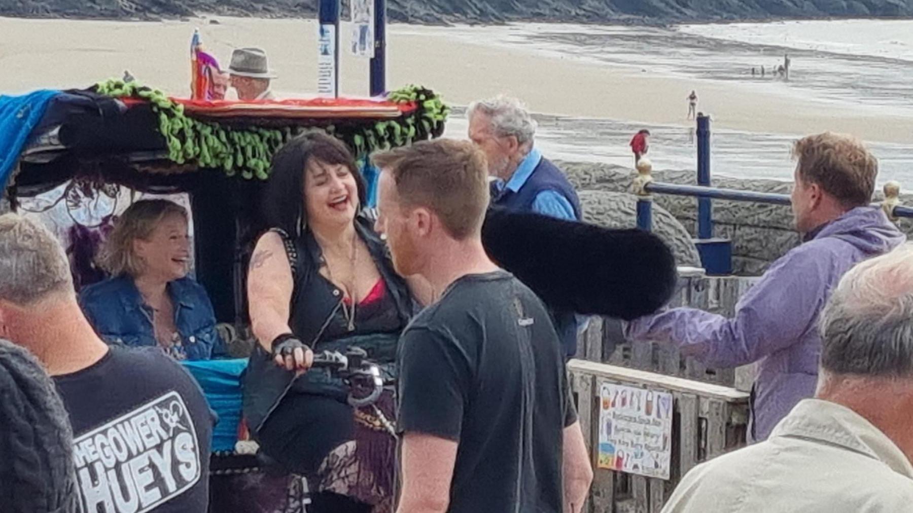 Jones, Corden and Page pictured laughing together on set