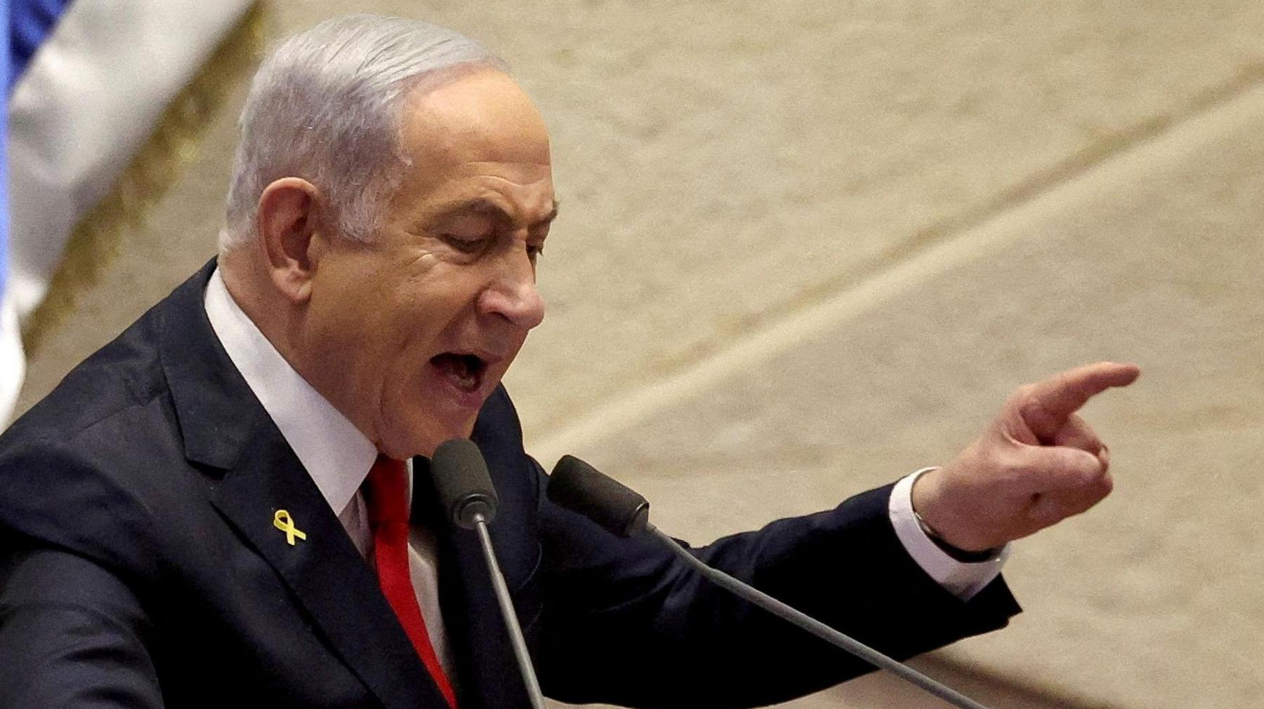 Israel's Prime Minister Benjamin Netanyahu pointing whilst speaking to his parliament