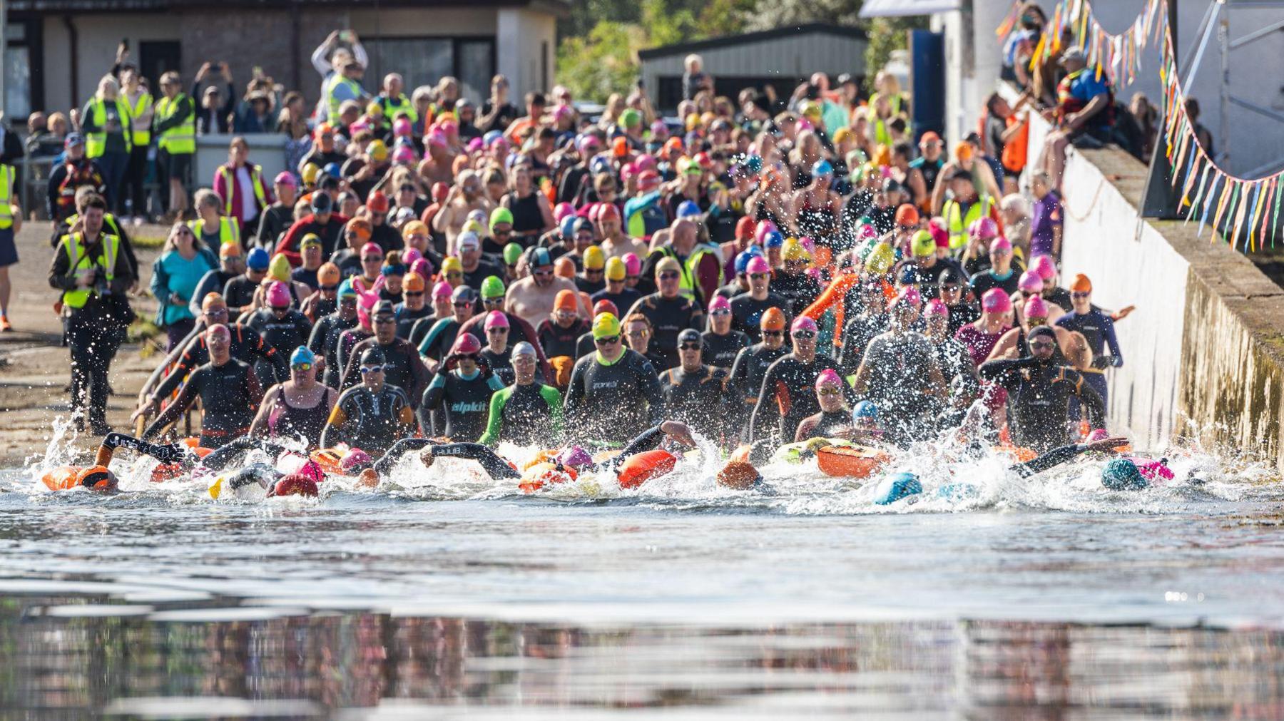 Swimmers enter the water for the Kessock Ferry Swim