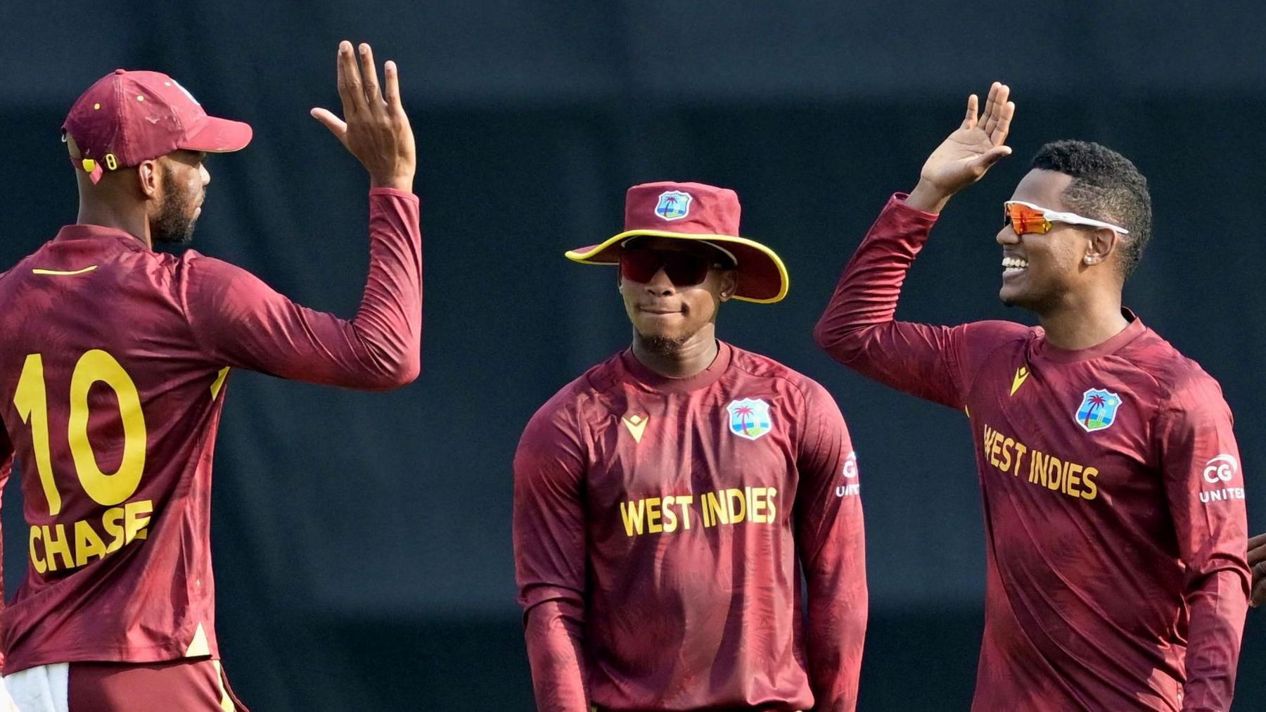Akeal Hosein celebrates taking a wicket during West Indies' win over Bangladesh