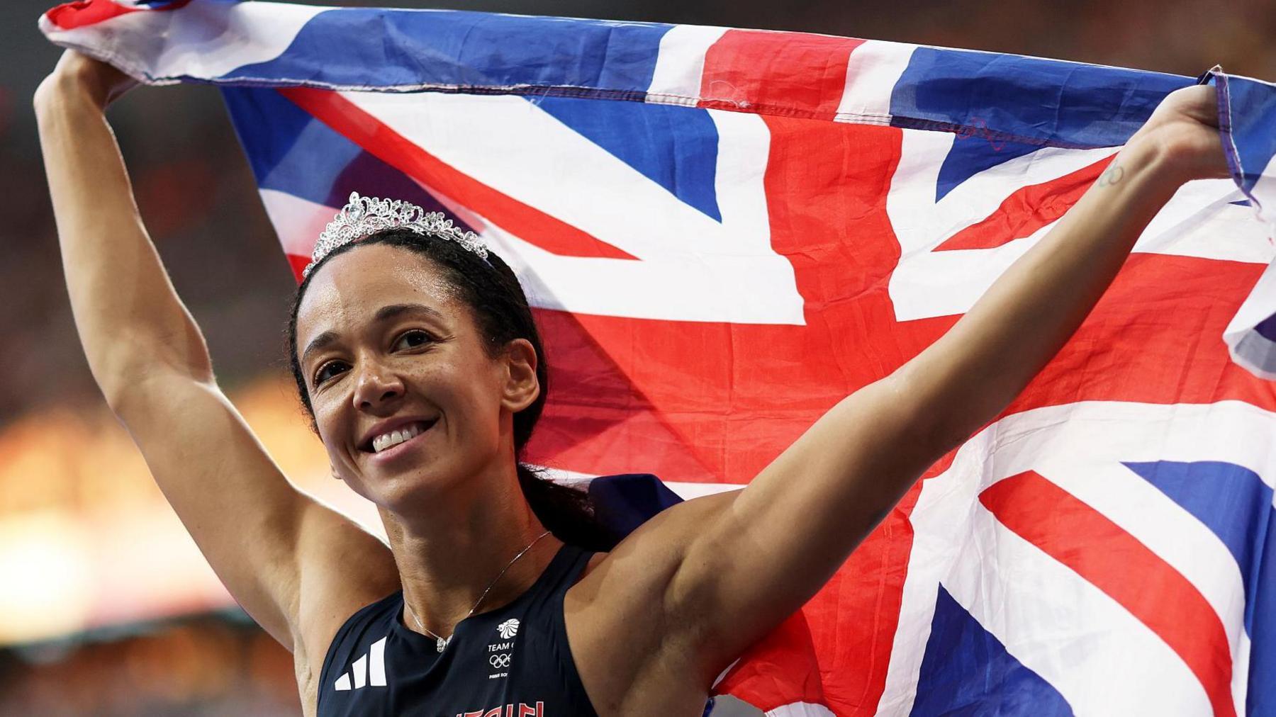 Katarina Johnson-Thompson celebrates with a British flag after winning Olympic silver at Paris 2024