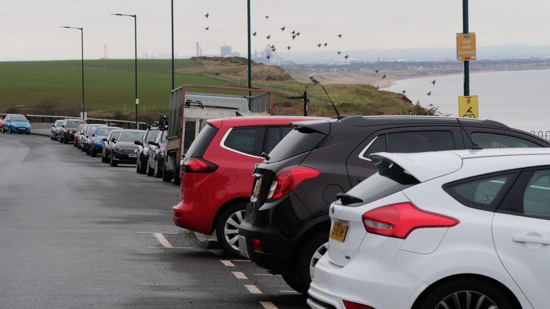 Cars parked along Marine Parade