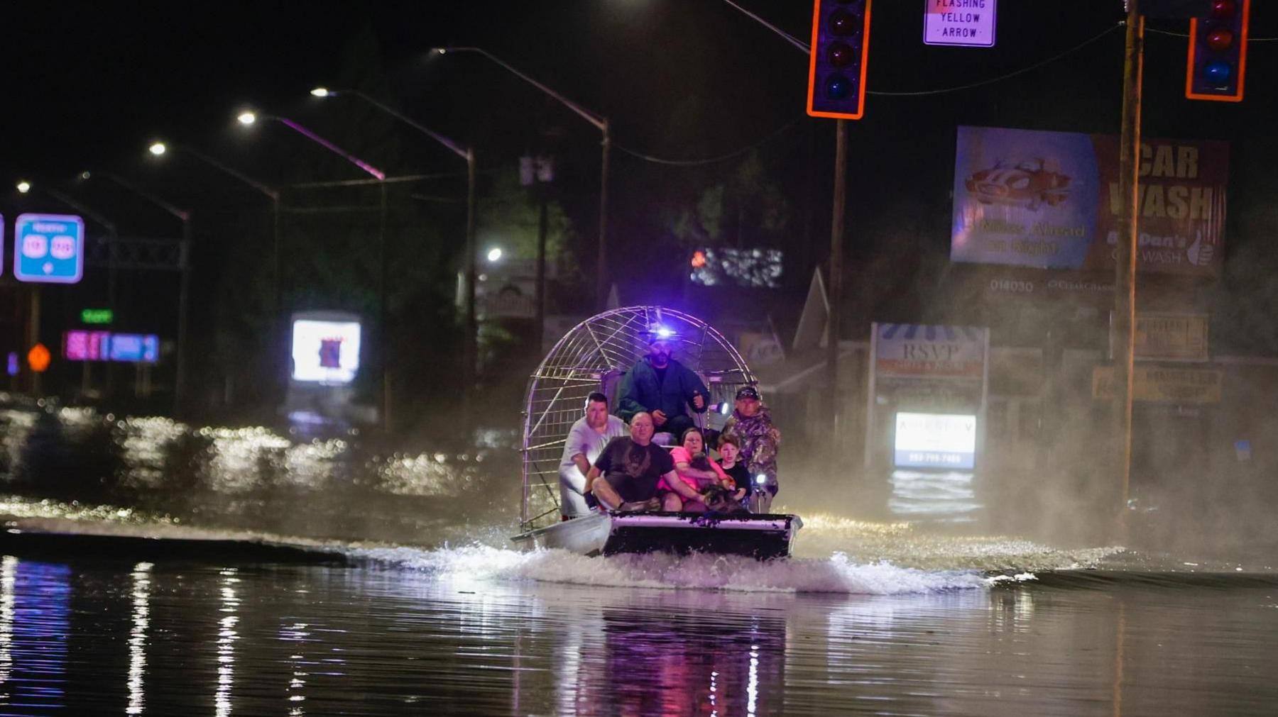 An airboat transports residents rescued from flood waters due to storm surge in Crystal River
