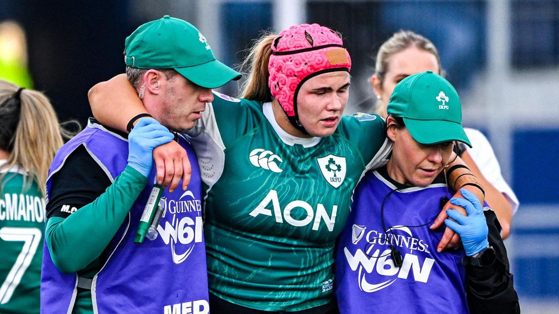 Dorothy Wall hobbles off during Ireland's loss to Scotland