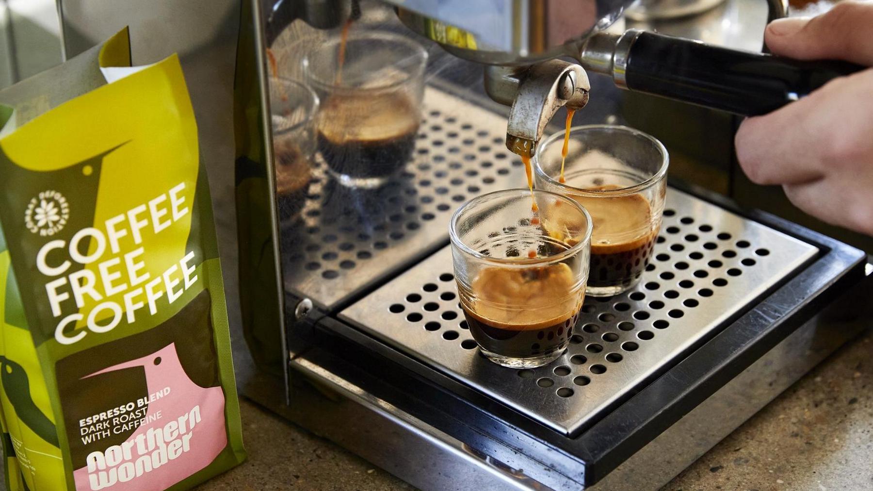 A coffee machine makes two espressos using Northern Wonder beanless coffee.