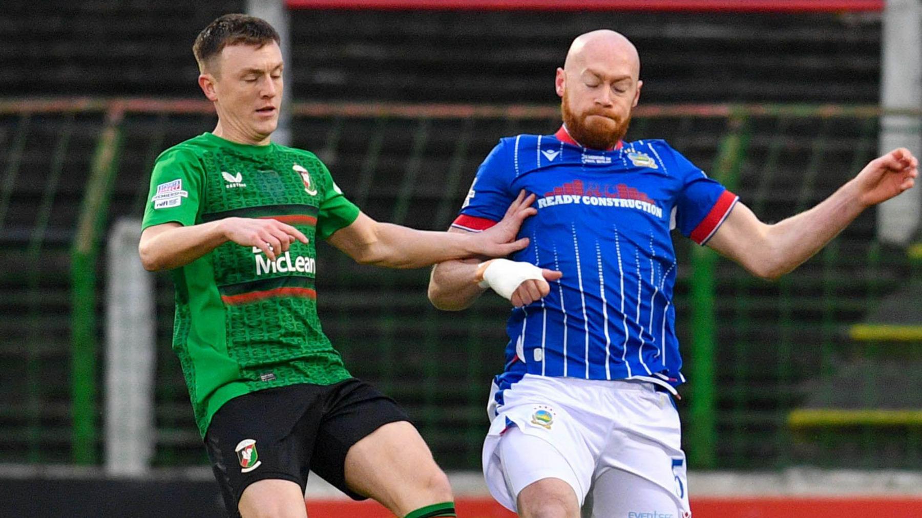 Glentoran's James Singleton and Chris Shields of Linfield