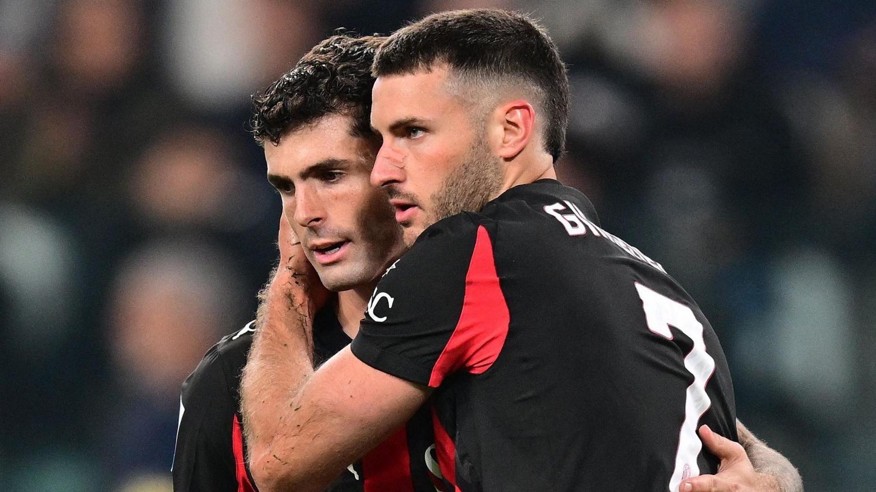 AC Milan's Santiago Gimenez consoles team-mate Christian Pulisic