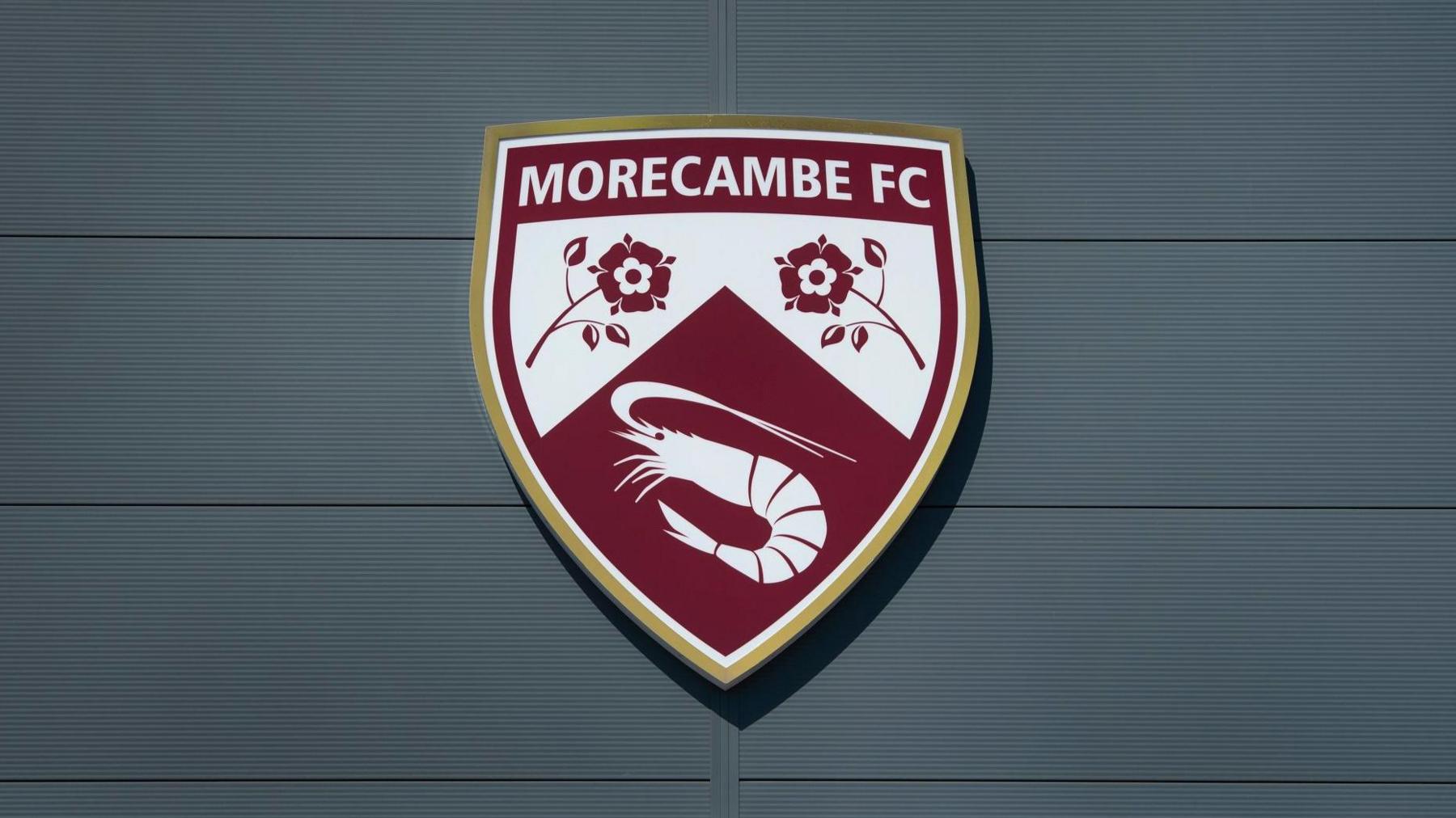 Morecambe's crest on their Mazuma Stadium home
