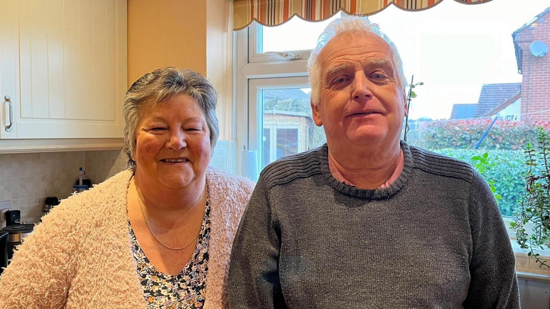 David and Irene Hodson stood in their kitchen, at their home near the church.