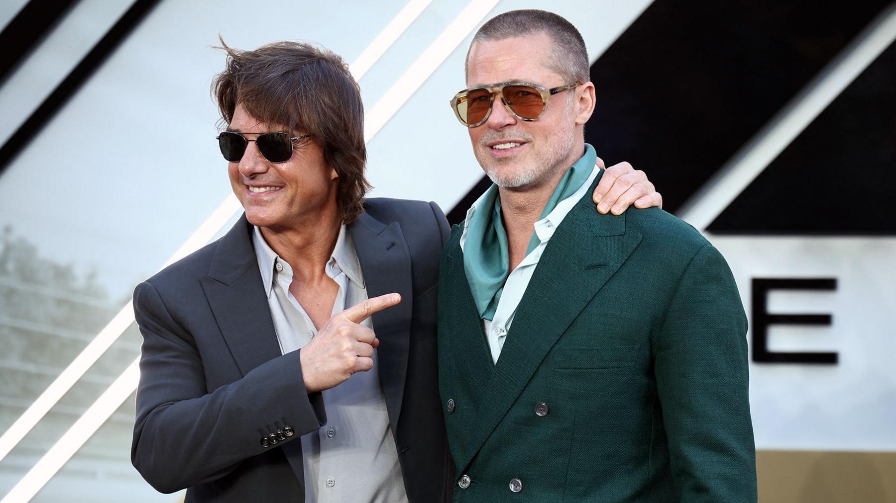 An AI-generated video still shows a dynamic action scene with digital likenesses of Tom Cruise and Brad Pitt in a fistfight.