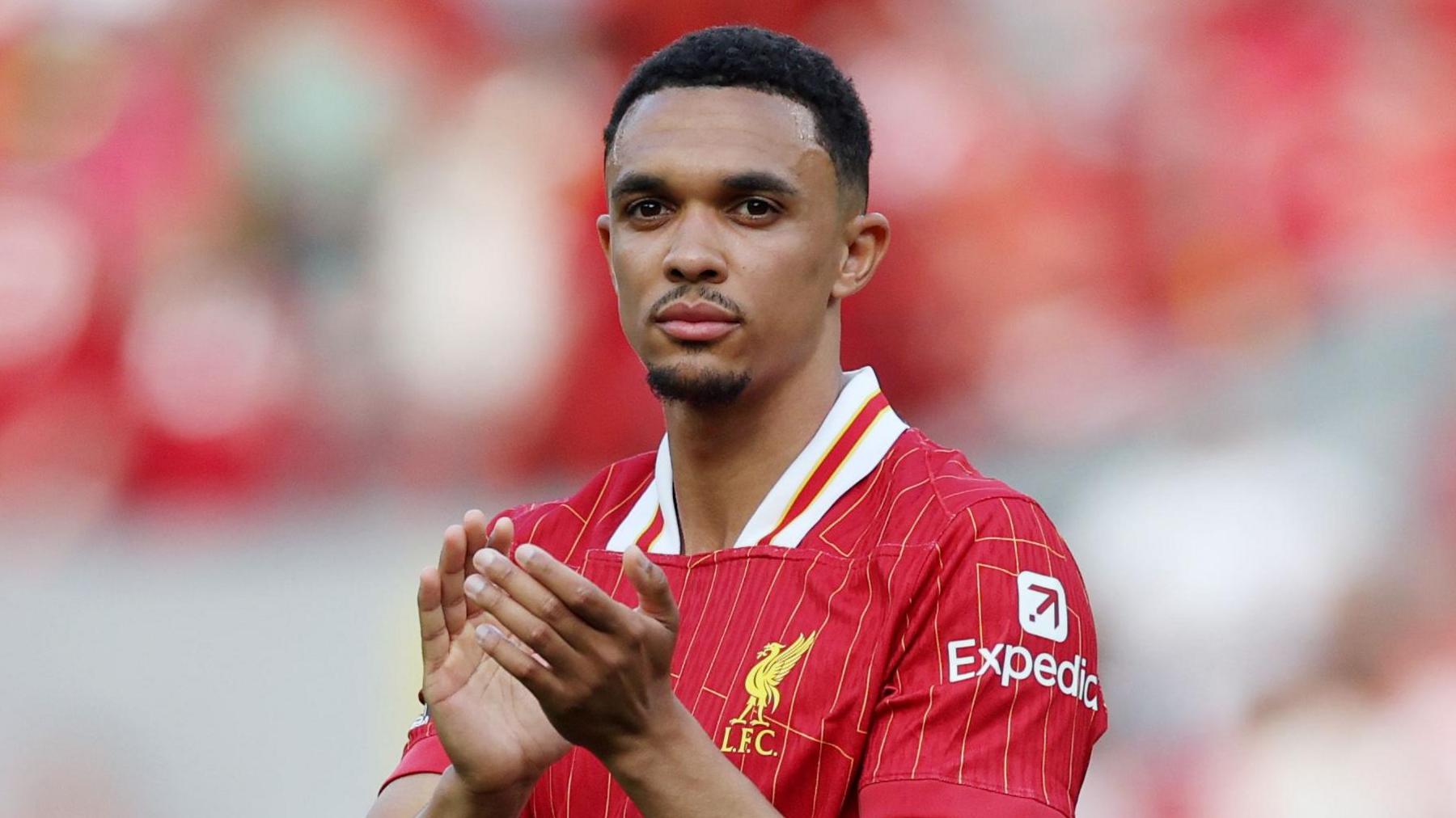 Trent Alexander-Arnold applauds the Liverpool fans after a game at Anfield last season