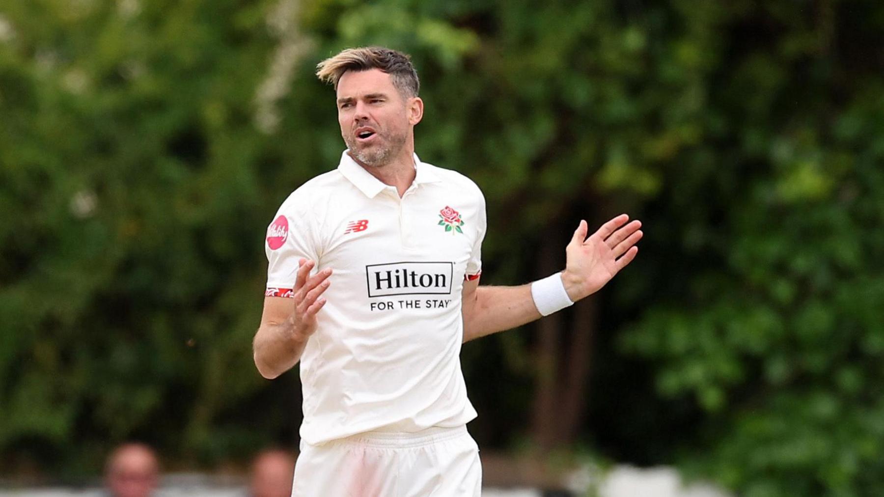 Jimmy Anderson bowling for Lancashire at Southport last July