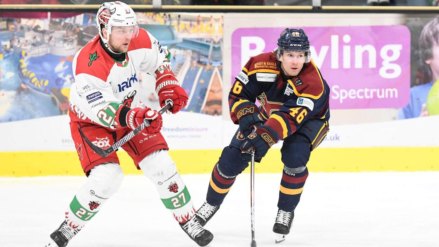 Reid Duke of Cardiff Devils (L) and Michael Crocock of Guildford Flames in action