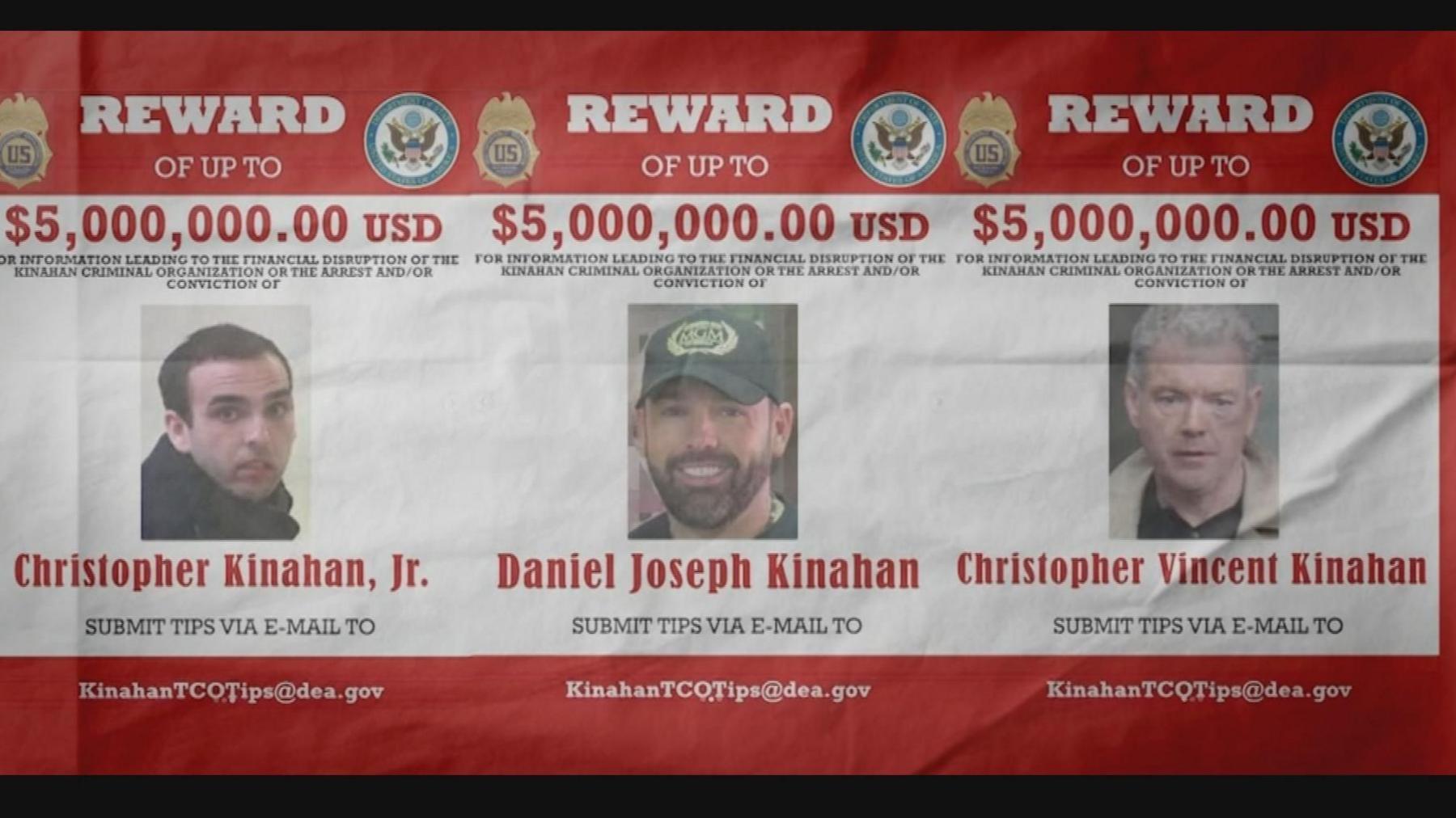 An FBI red and white reward poster, it names Christopher Jr, Christopher Vincent and Daniel Joseph Kinahan - with three headshots, daniel is wearing a hat, christopher snr has short grey hair and a cream jacket, Christy Jnr is in a black jacket with short black hair.... There are several US federal badges and logos, the test offers a Reward of $5,000,000 USD