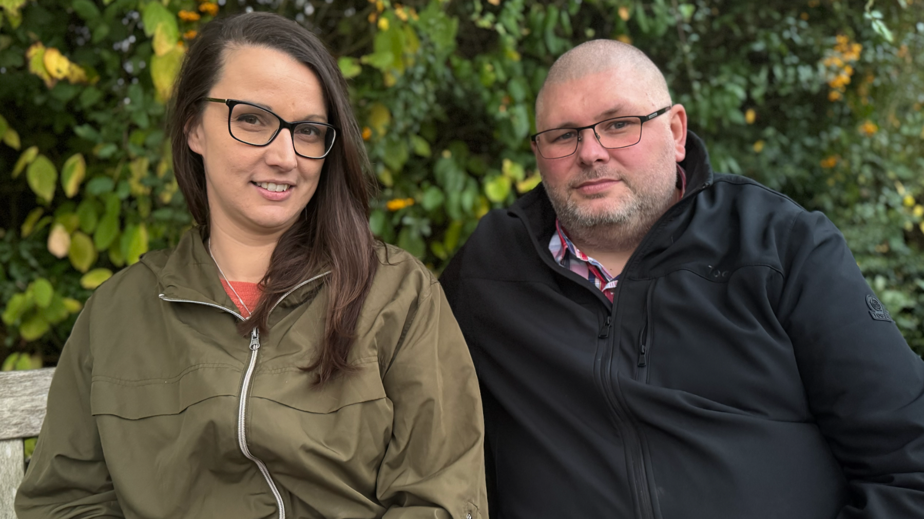 Zoe and Lewis Steeper sat on Oliver's bench in a park