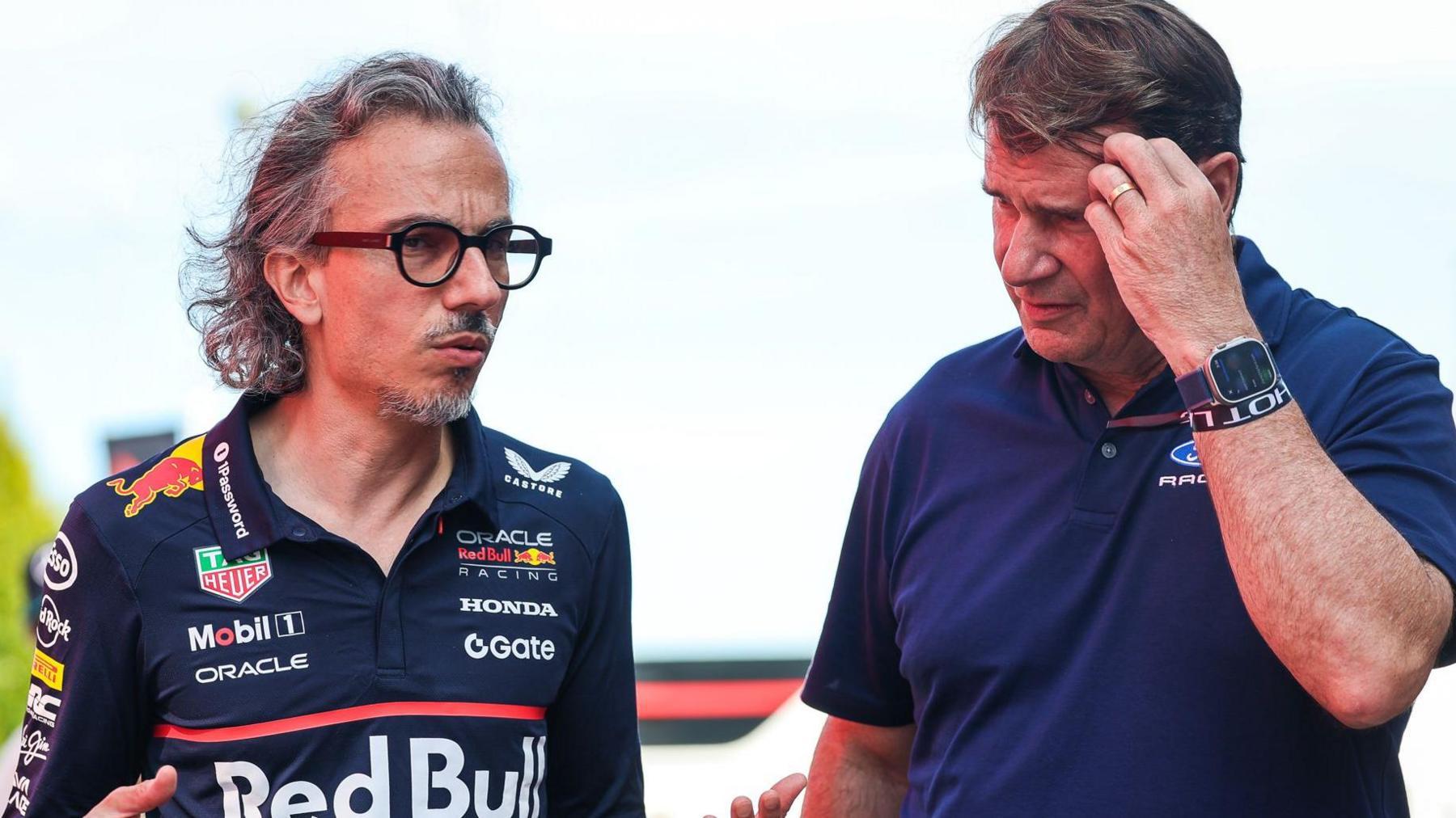 Red Bull team principal and Ford chief executive officer Jim Farley in conversation at the 2025 Italian Grand Prix