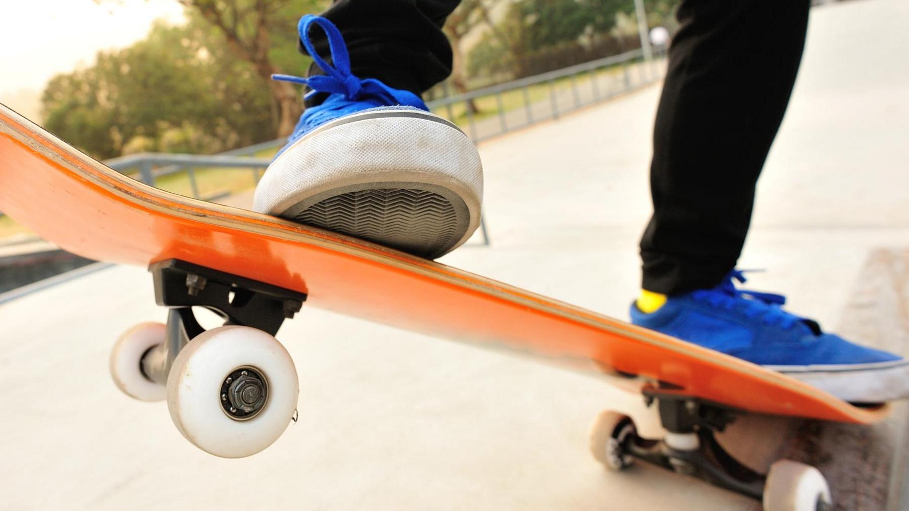 A person skating at a skatepark