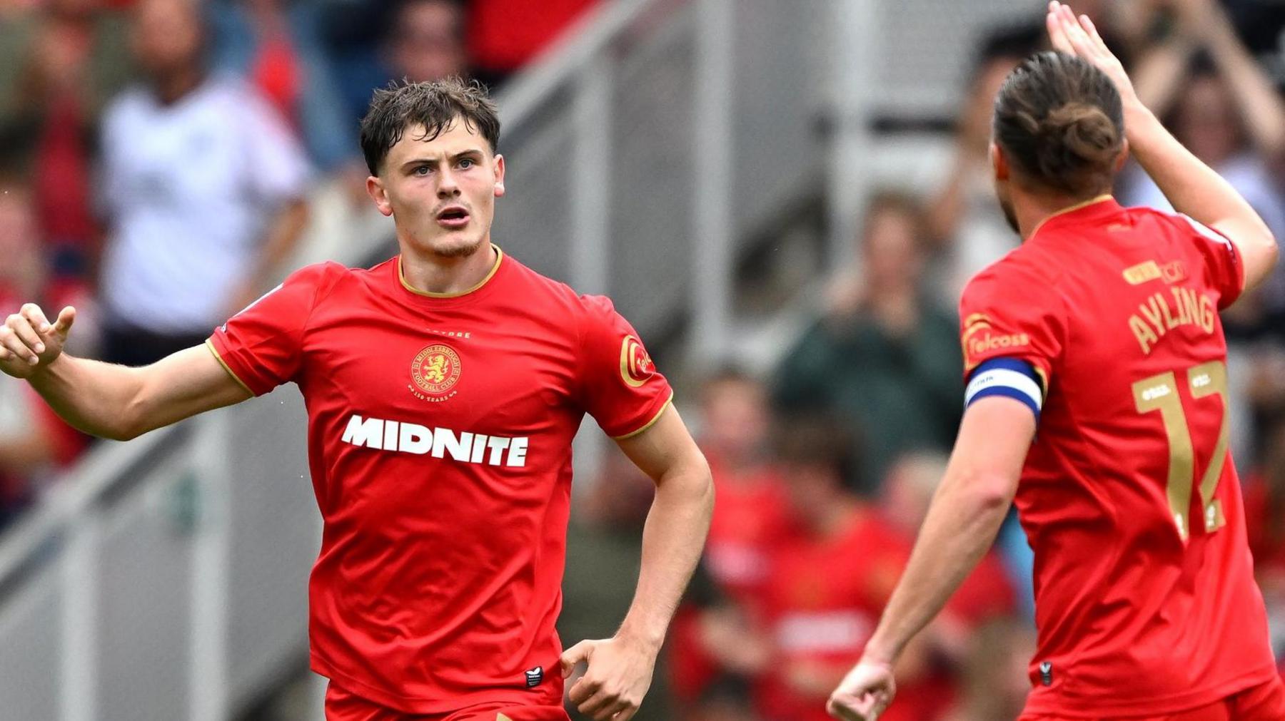 Will Lankshear (left) celebrates scoring for Middlesbrough against Lincoln