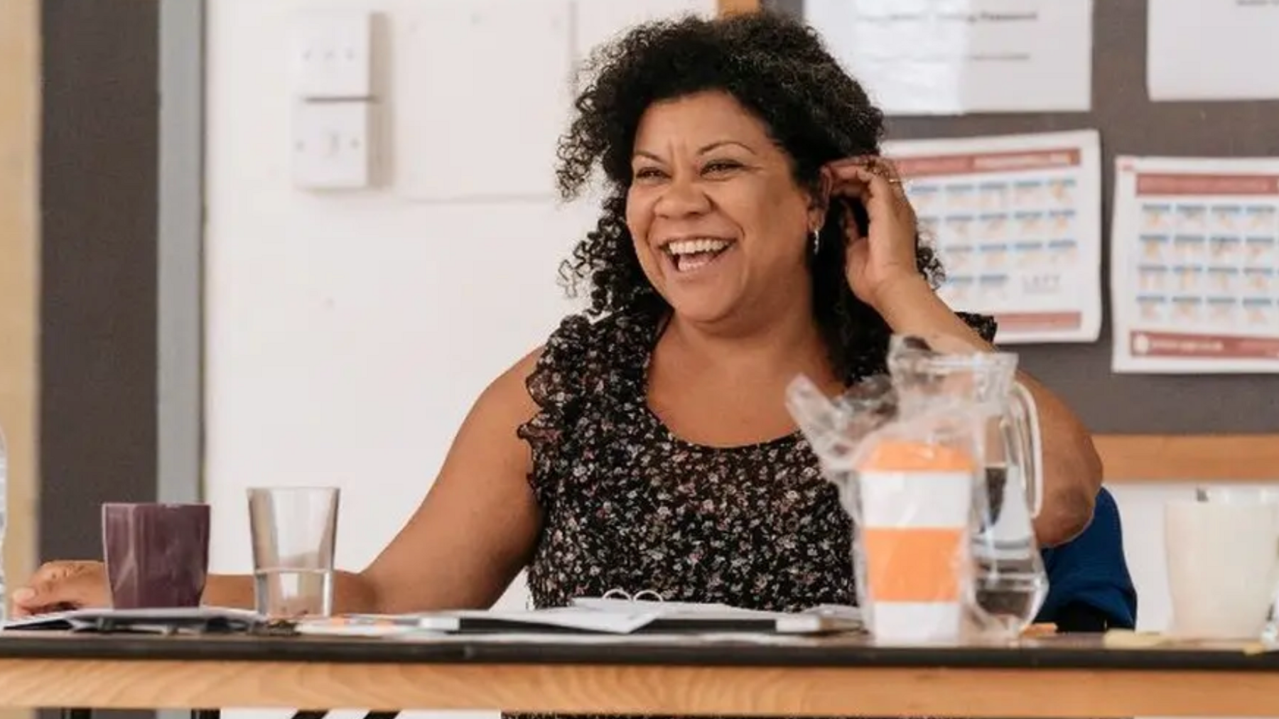 Nancy Medina sitting at a desk.