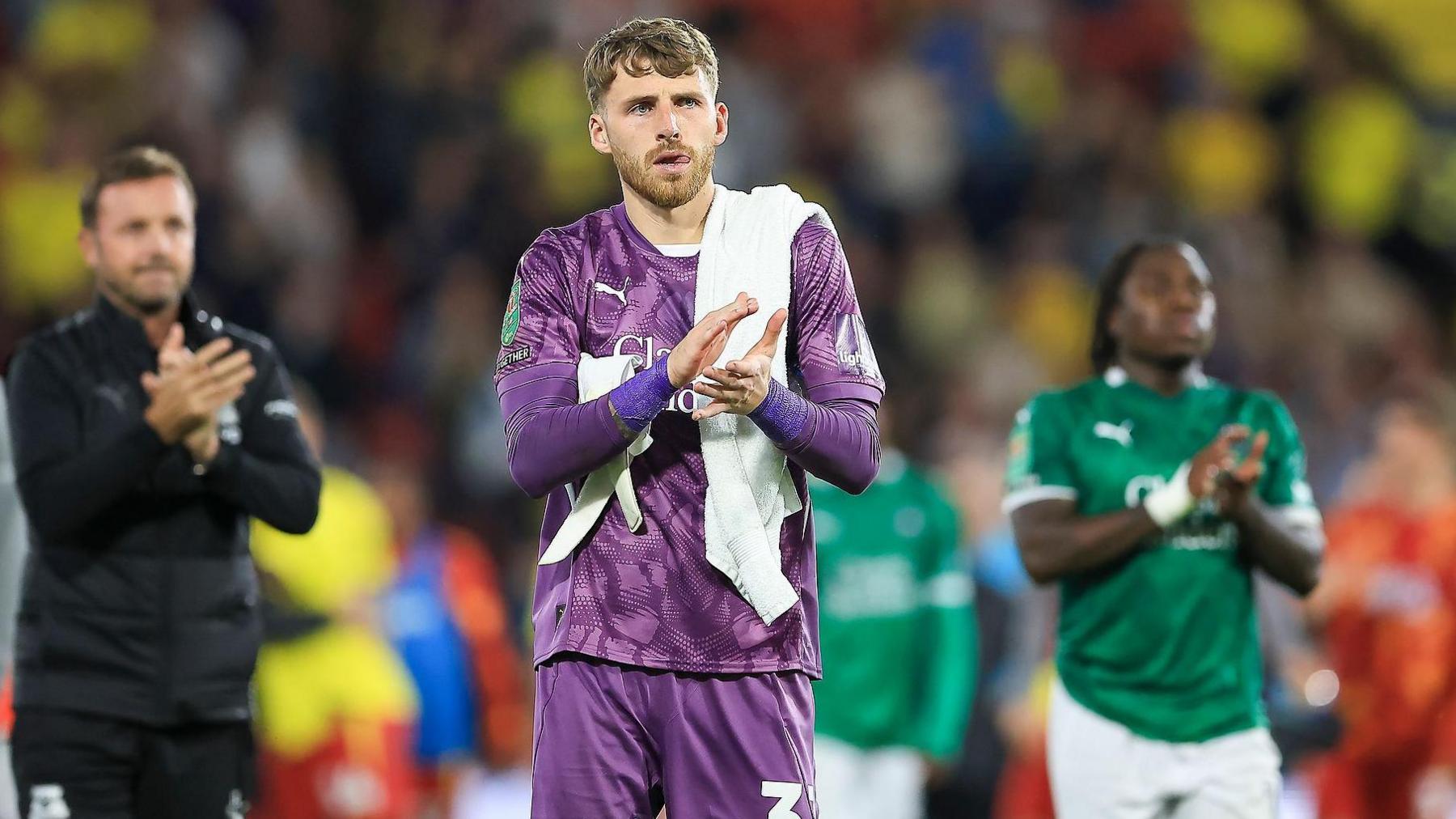 Daniel Grimshaw applauds the Plymouth fans after a match