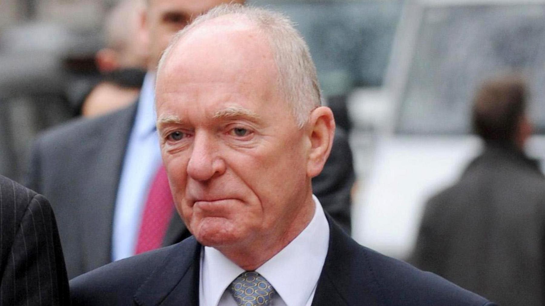 John Macnamara, wearing a suit, tie and a wool coat, pictured outside the High Court in 2008