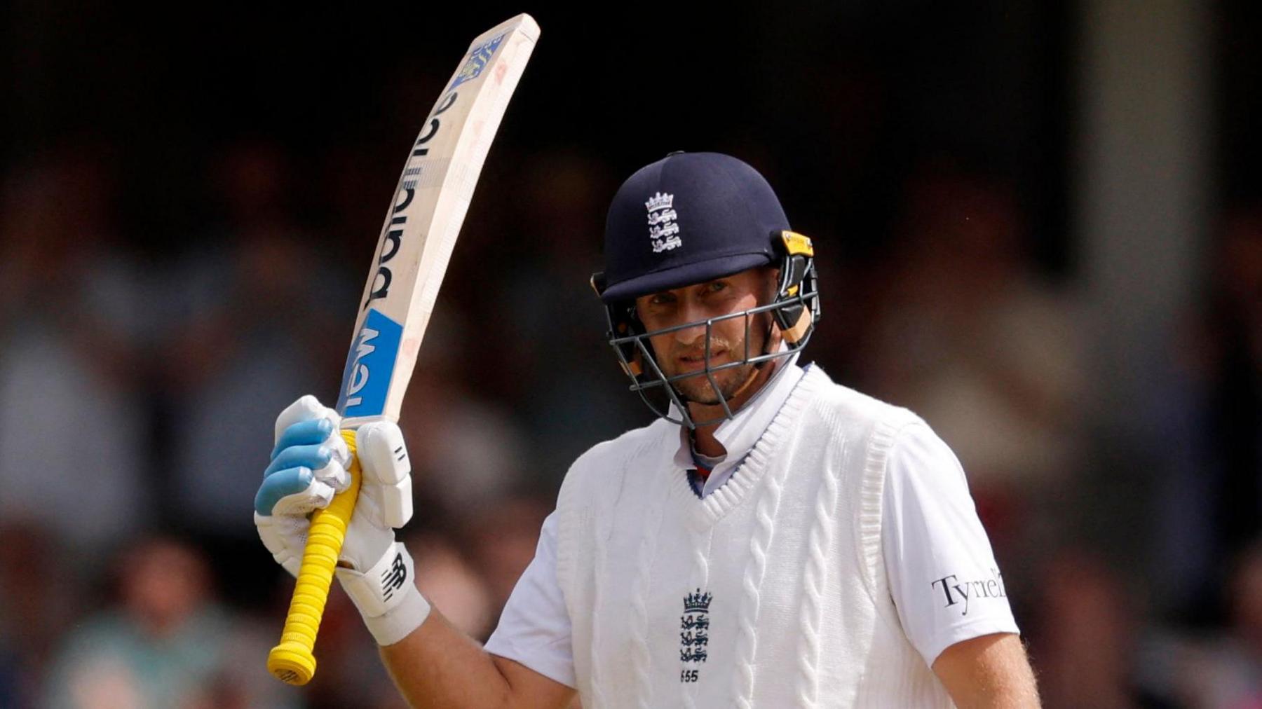 England batter Joe Root raises his bat to acknowledge the crowd after reaching 14,000 Test runs