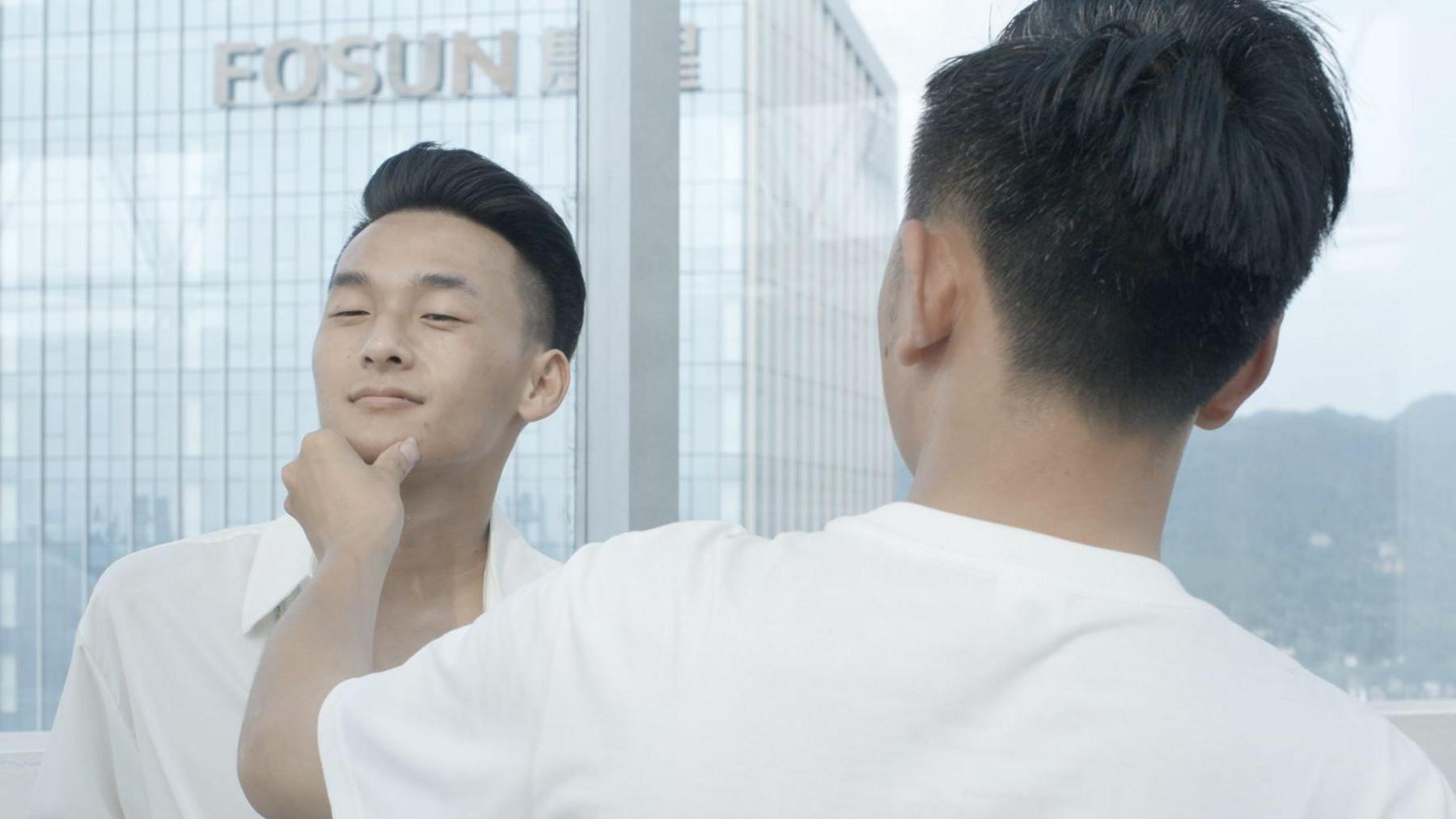 Li with Hao, who poses him for a photograph