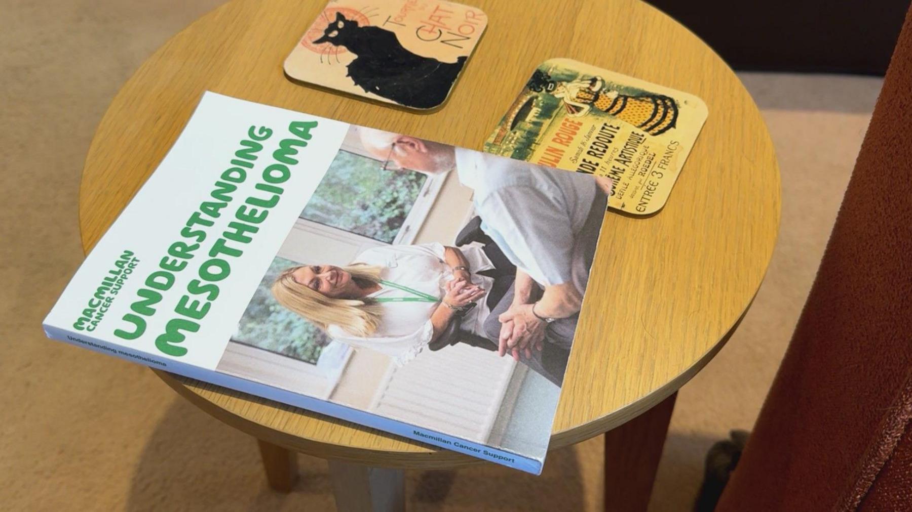 A Macmillan Cancer Support guide to understanding mesothelioma on a table.