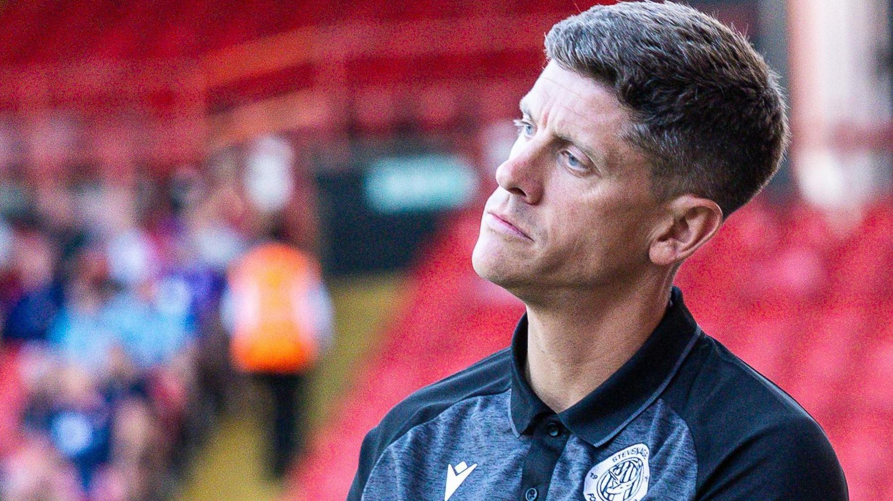 Alex Revell looks confused on the touchline