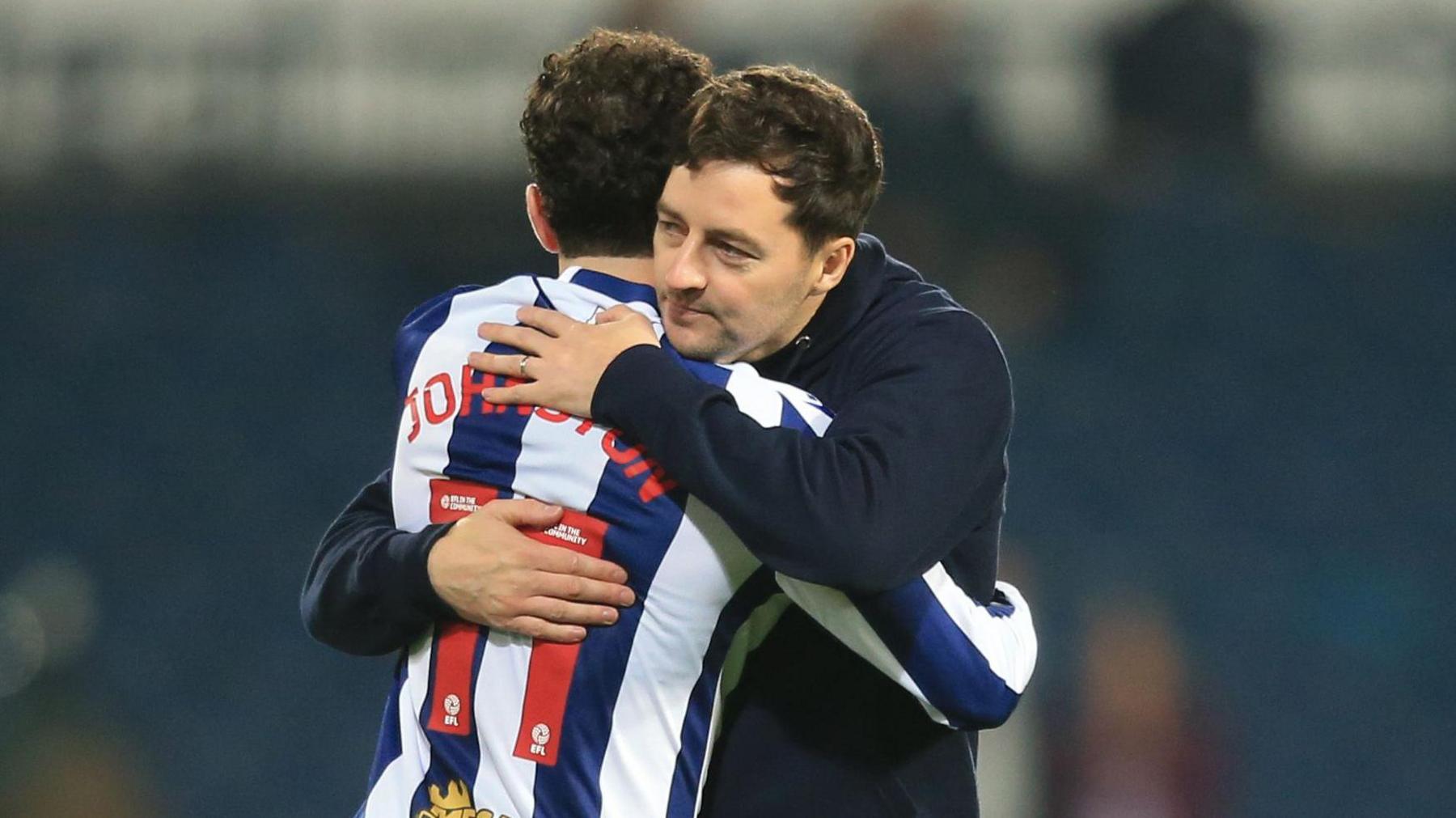 West Bromwich Albion boss Ryan Mason hugging Mikey Johnston