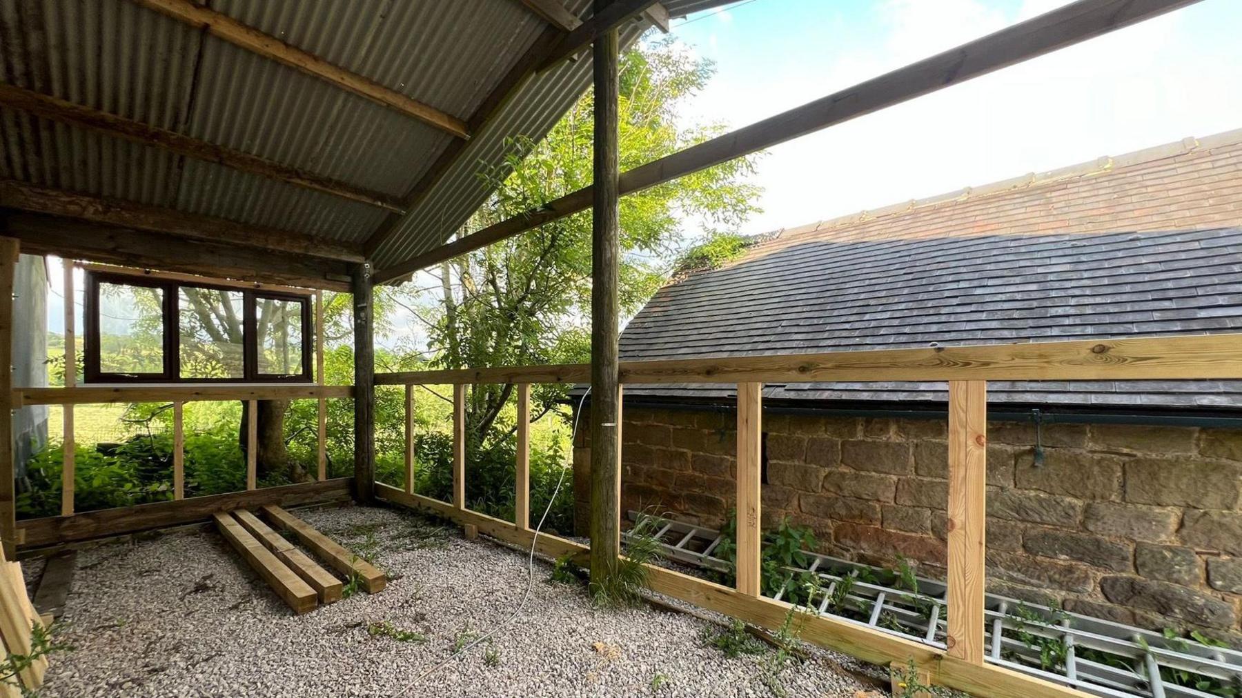 The wooden structure of Belper Shed, with a corrugated roof