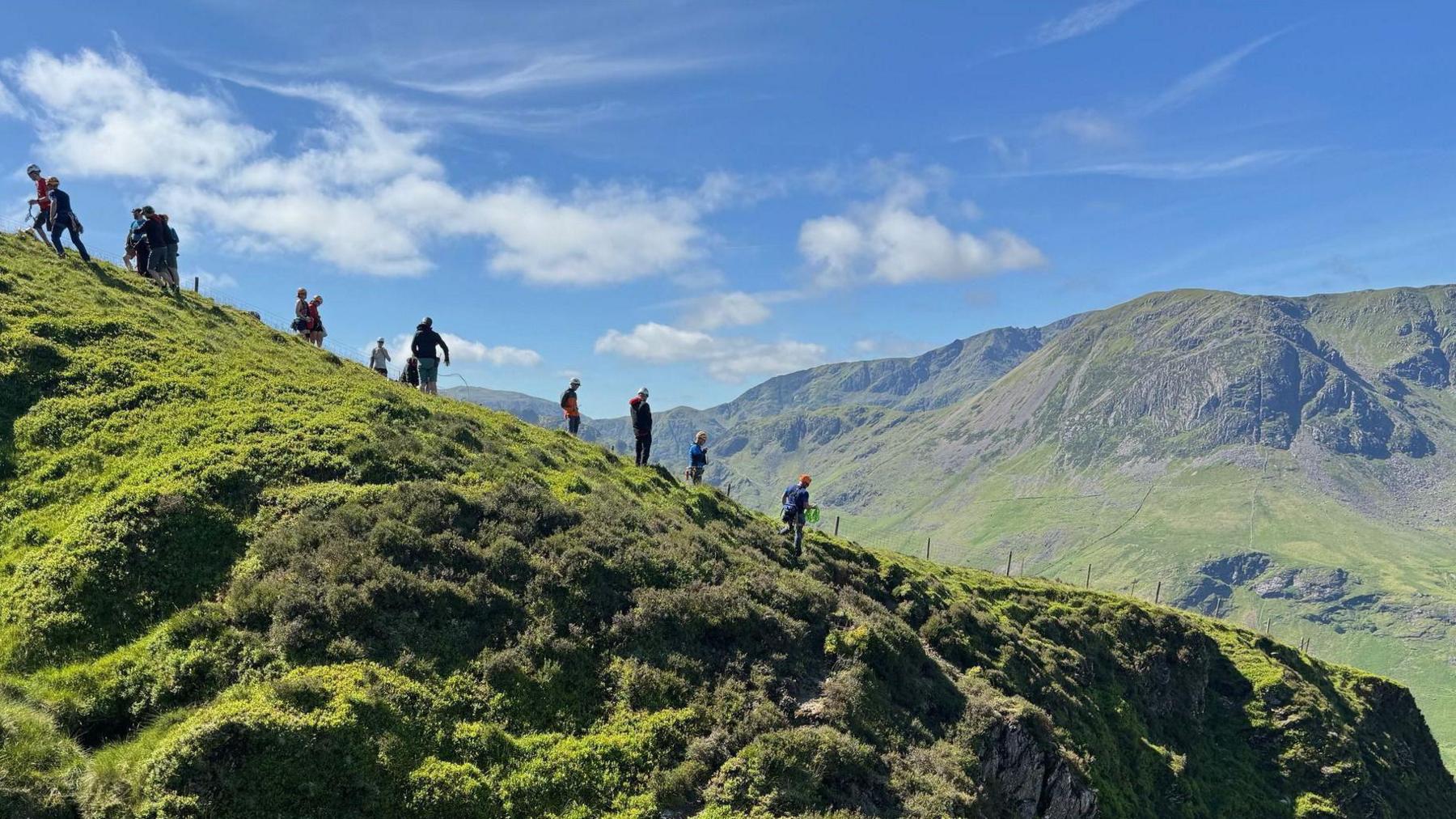 Mountain rescue volunteers on the fells looking for Mr Walch