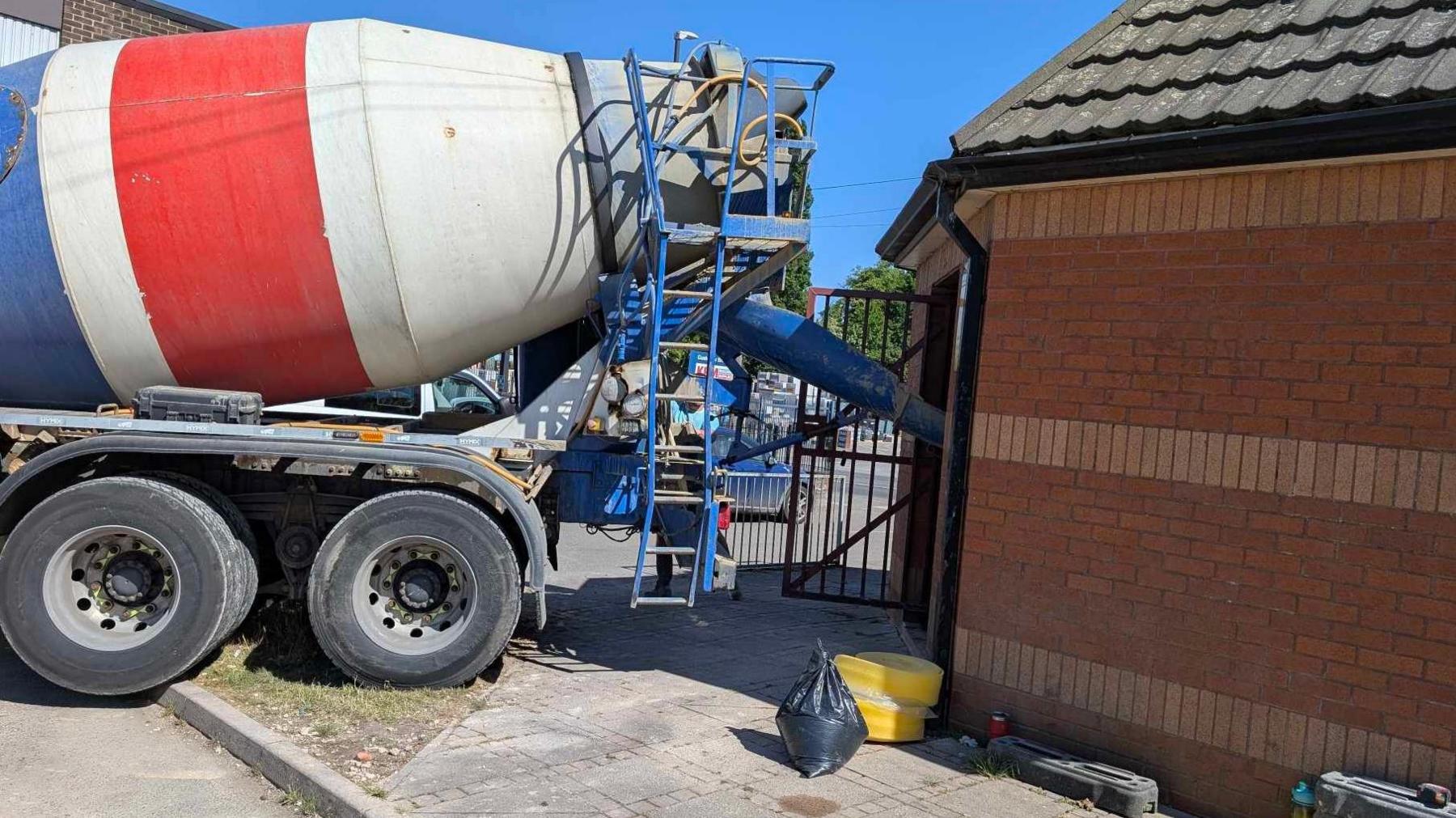 Truck supplying concrete into a toilet building in Ilkeston