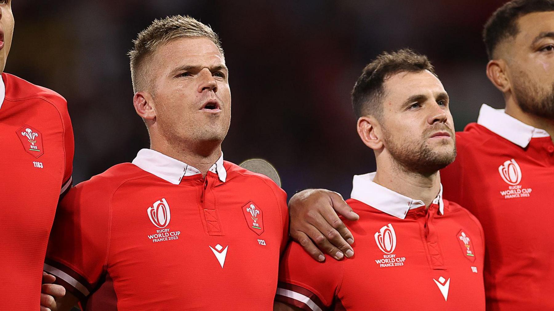 Gareth Anscombe (left) and Tomos Williams during the national anthem for Wales before their World Cup 2023 match against Australia