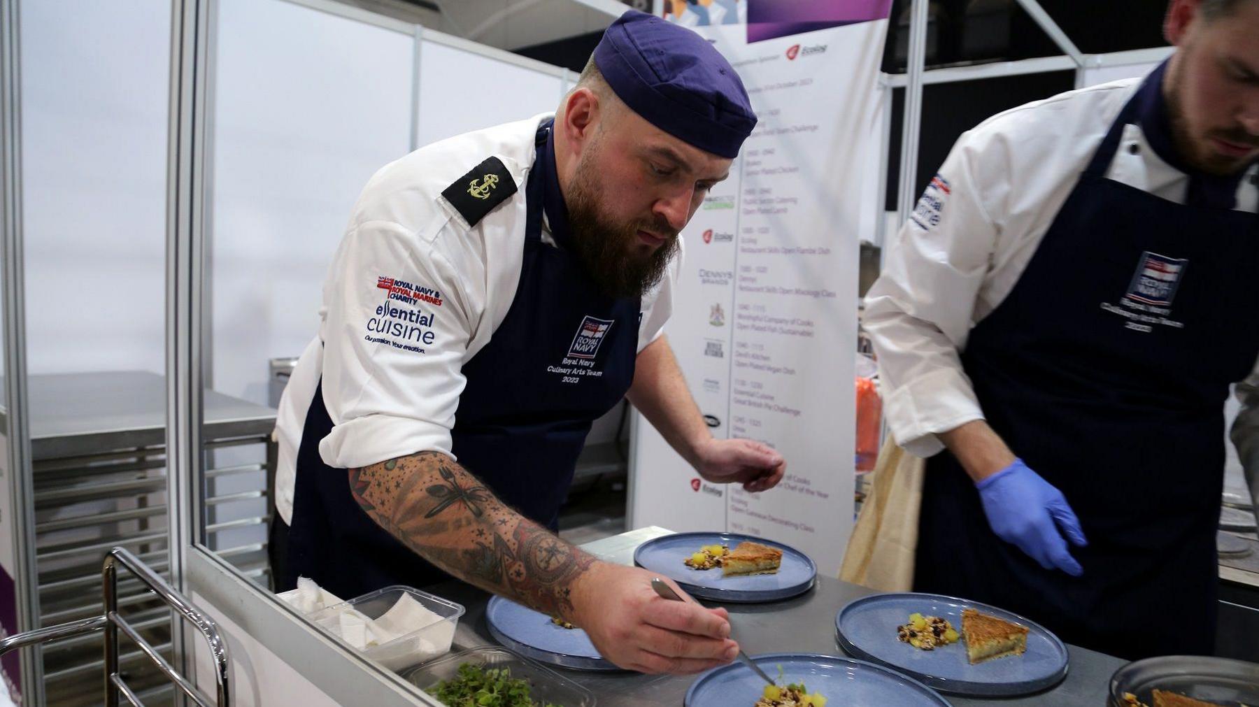 Carl Tester cooking on board the ship