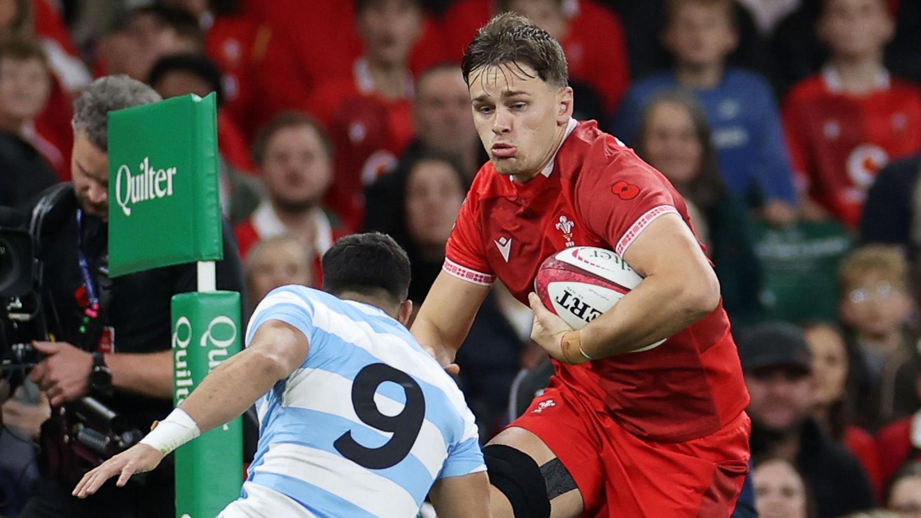 Wales flanker Alex Mann carries hard against Argentina