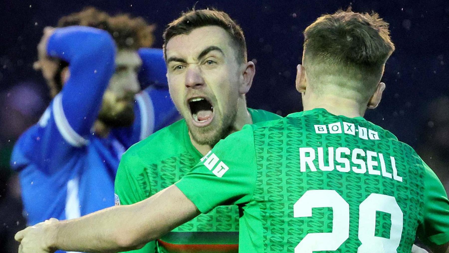 Joe Thompson celebrates scoring his first goal against Loughgall