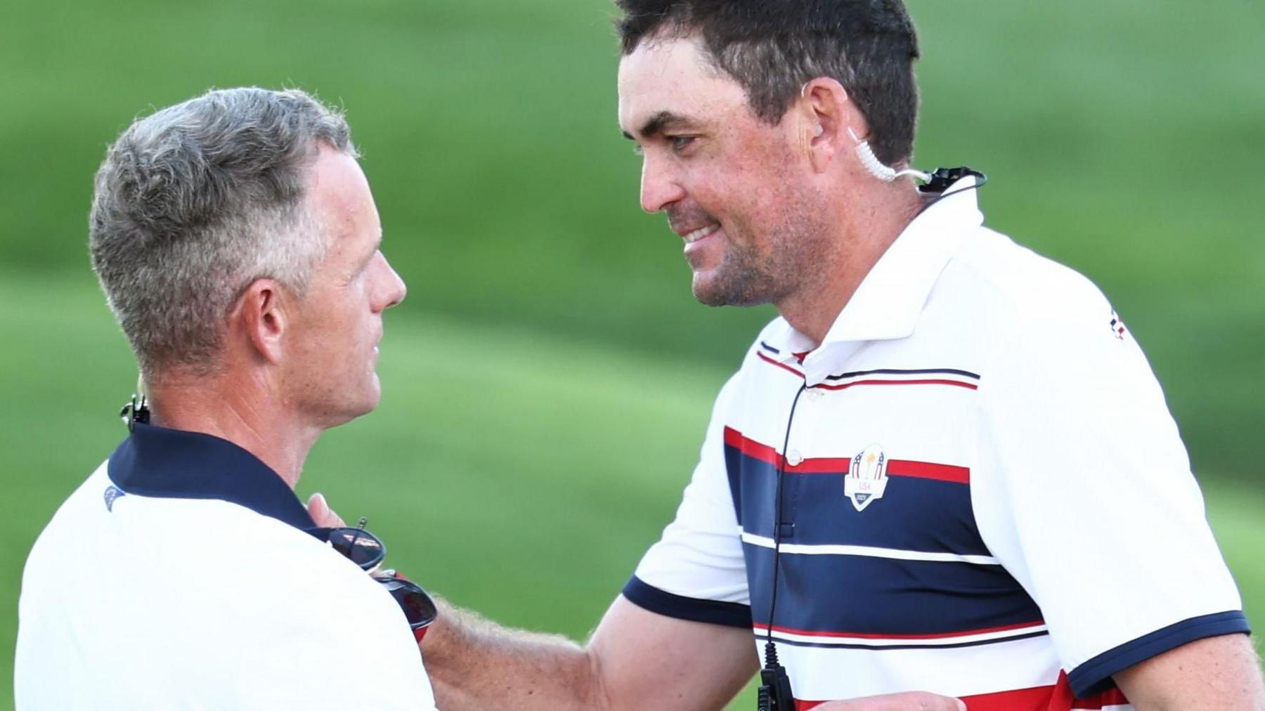 Europe captain Luke Donald and US skipper Keegan Bradley embrace at the Ryder Cup