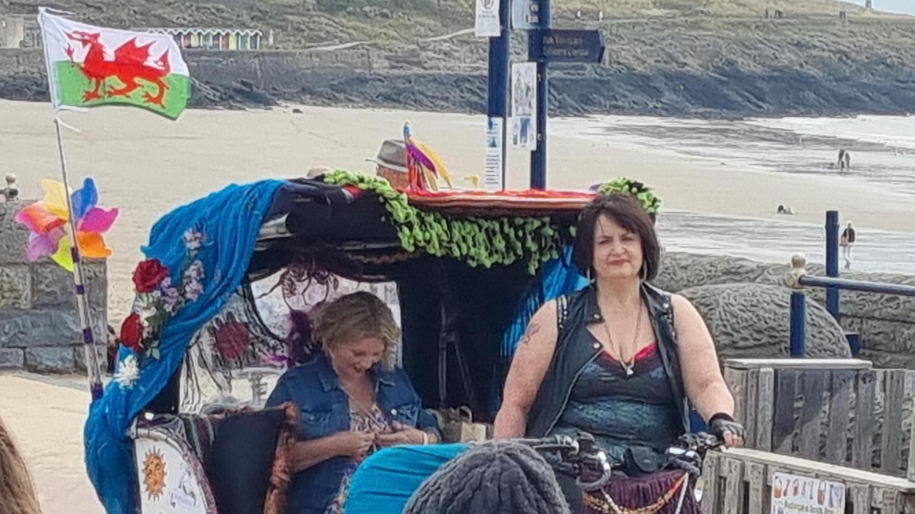 The rickshaw was decorated with a Wales flag 