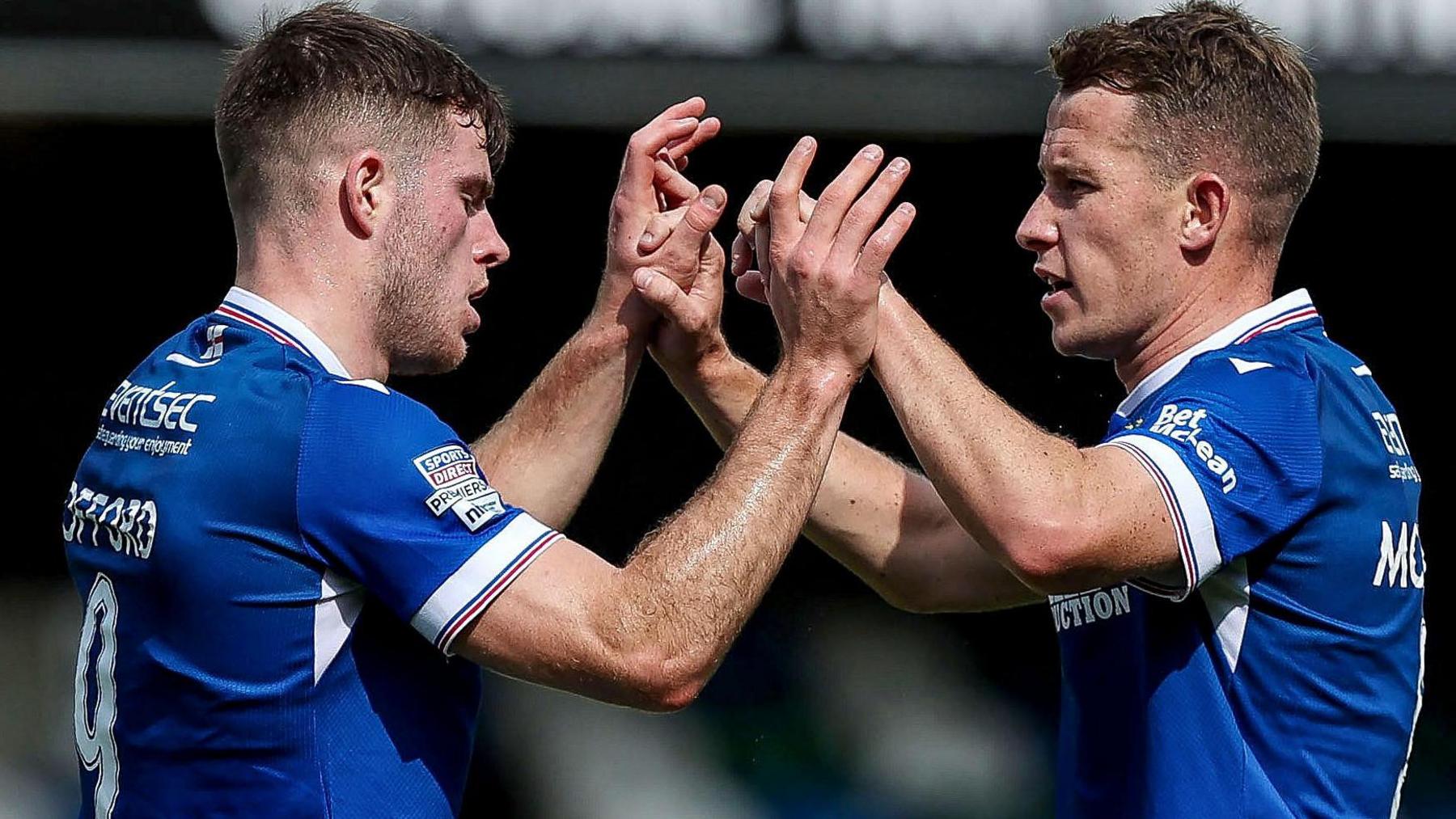 Kieran Offord and Kyle McClean celebrating the Linfield goal