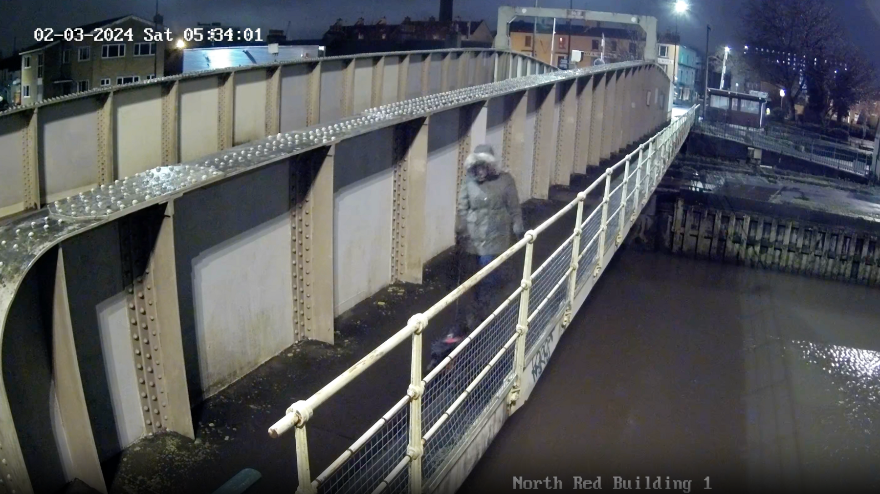 CCTV footage of dog walker around the Brunel Swing Bridge