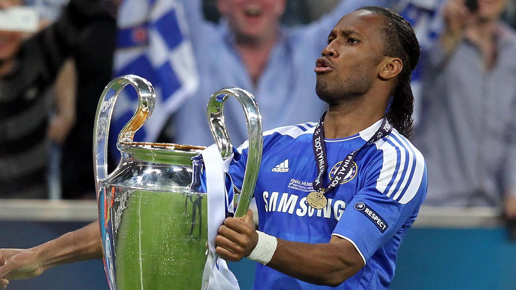 Didier Drogba celebrates with the Champions League Trophy