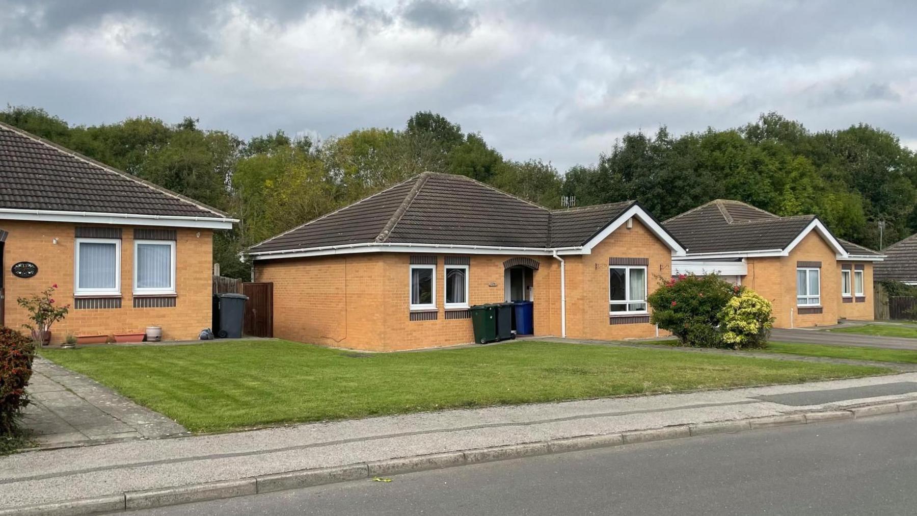 Bungalows with neatly mowed lawns